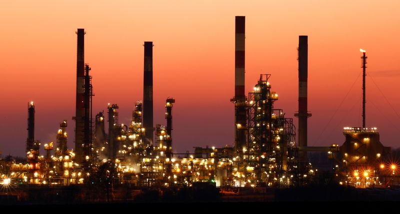 © Reuters. The chimneys of the Total Grandpuits oil refinery are seen just after sunset, southeast of Paris, France, March 1, 2021.  REUTERS/Christian Hartmann/File Photo