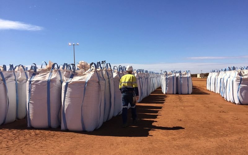 © Reuters. FILE PHOTO: A Lynas Corp worker walks past sacks of rare earth concentrate waiting to be shipped to Malaysia, at Mount Weld, northeast of Perth, Australia August 23, 2019. Picture taken August 23.   REUTERS/Melanie Burton/File Photo