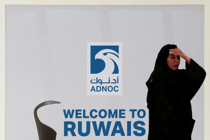 © Reuters. FILE PHOTO: An Emirati woman arrives to ADNOC